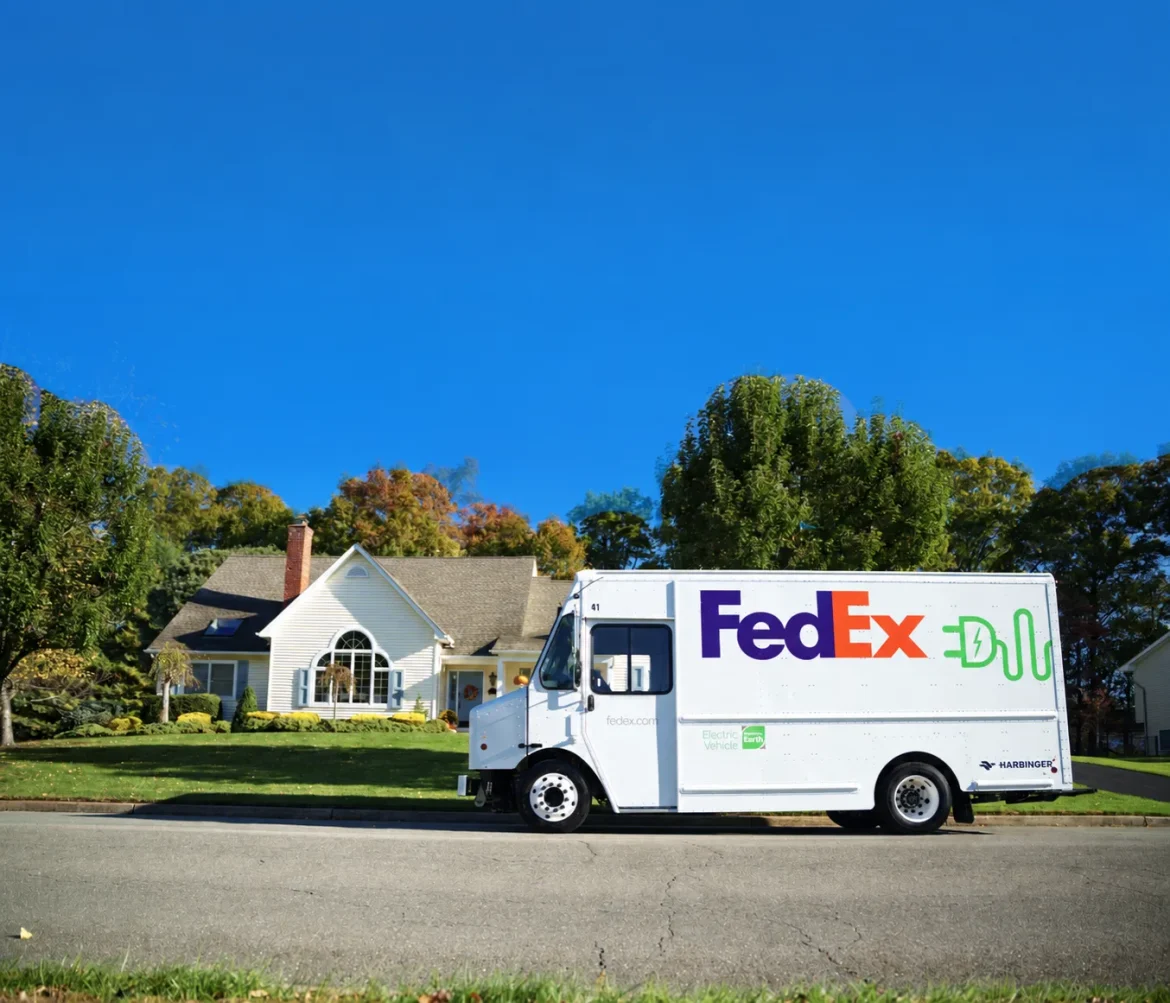 FedEx electric delivery truck built on a Harbinger electric vehicle platform parked on a residential street.